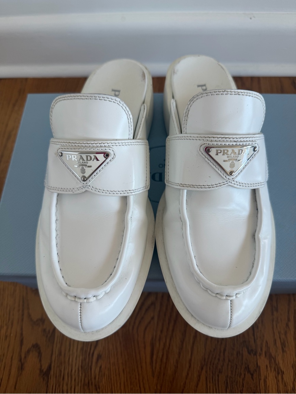 Prada White Leather Loafer Flats with Silver Logo Plaque